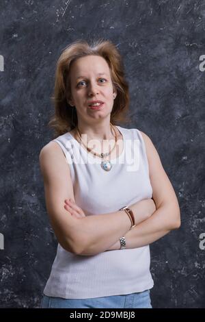 Cheerful 40 years old woman studio portrait Stock Photo