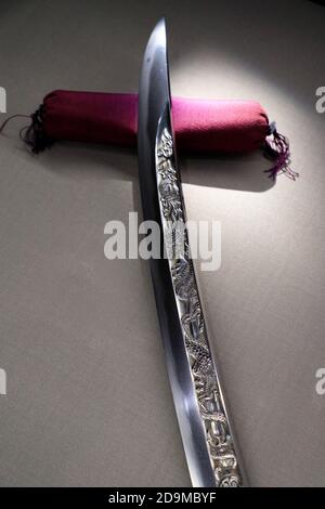 A small Tachi sword with engravings from Momyama period display in Japanese Sword Museum.Tokyo.Japan Stock Photo