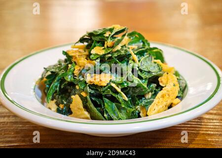 Kale Caesar Salad with Parmesan Crisps Stock Photo