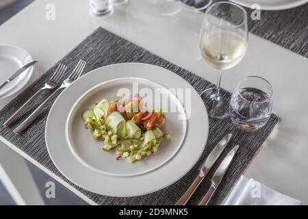 Table served in the restaurant. Luxury table setting, gourmet food background. Dining in elegant, top quality restaurant, modern table Stock Photo