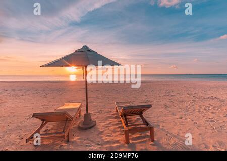 Romantic beach scenery, summer vacation or honeymoon background. Travel adventure sunset landscape of tropical island beach. Stock Photo