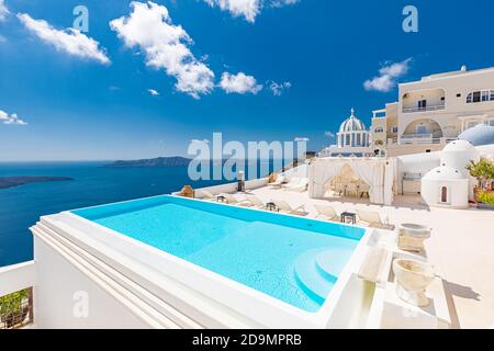 Romantic holidays Santorini resorts with infinity pool and sea view. Amazing summer travel landscape and white architecture, honeymoon destination Stock Photo