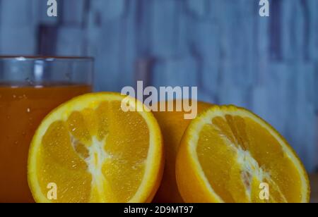 Orange juice glass on wooden table Stock Photo
