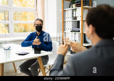 Learning Deaf People Language Sign With Face Mask Stock Photo