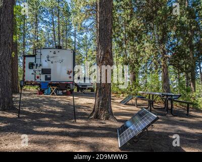 Trailer camper charging batteries with solar panels, Mancos State Park, Mancos, Colorado. Stock Photo