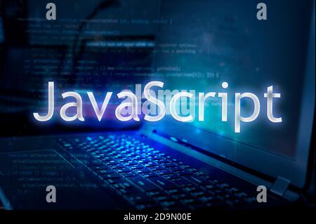 JavaScript inscription against laptop and code background. Learn JavaScript programming language, computer courses, training. Stock Photo