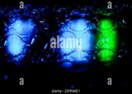 abstract background created with a colorful image through a sheet of plastic bubble wrap Stock Photo