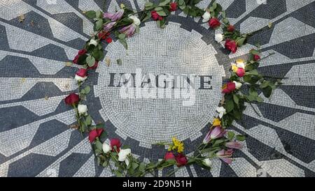 John Lennon Memorial in Central Park, NY, USA, is part of Strawberry Fields designed by landscape architect Bruce Kelly and is dedicated to the memory of John Lennon who was assassinated in front of the Dakota Building on December 8, 1980 by Mark David Chapman Stock Photo