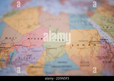 Chad on a colorful and blurry map of Africa with its main routes in red Stock Photo
