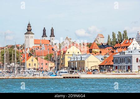 cityscape with old colorful buildings at harbour in Visby Sweden Stock Photo