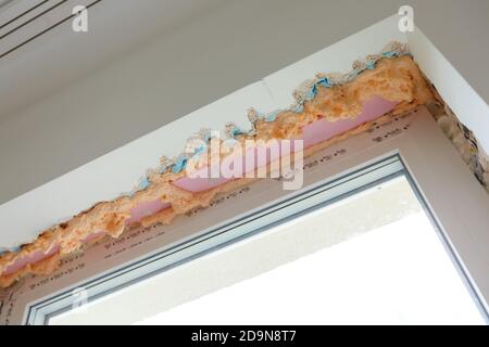 Process installation slopes of window. Using a moanting foam. Stock Photo