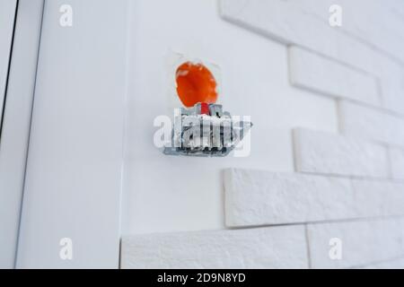 Electrical outlet during installation in office wall Stock Photo