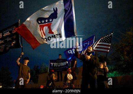 North Las Vegas, Nevada, USA. 5th Nov, 2020. A lone Democratic Party supporter protests amid President Donald Trump supporters outside the Clark County Election Department, where ballots from the election are being counted, on November 5, 2020 in North Las Vegas, Nevada. Democratic presidential nominee Joe Biden holds a slim lead over President Trump in the battleground state, which is still too close to call after Tuesday's election. Credit: David Becker/ZUMA Wire/Alamy Live News Stock Photo
