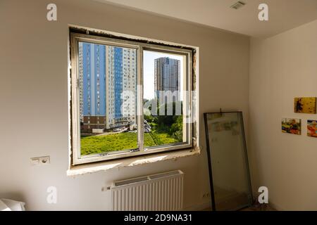 Process installation slopes of window. Using a moanting foam. Stock Photo