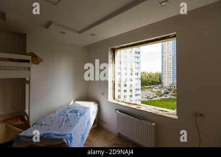 Process installation slopes of window. Using a moanting foam. Stock Photo