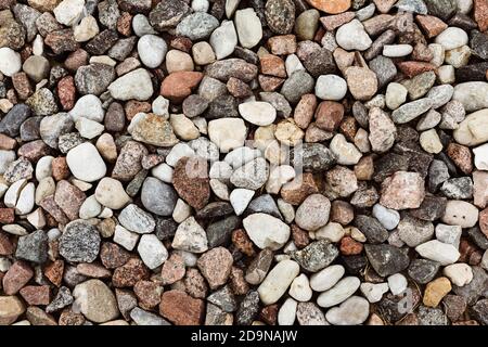 Different colored rocks and pebbles on a beach. Various colors and textures Stock Photo