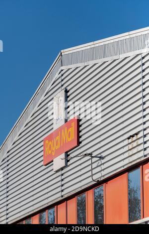 a royal mail sorting office in a large warehouse or factory unit building Stock Photo