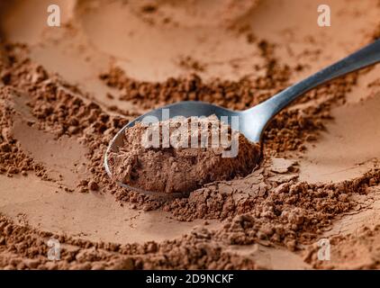 spoon of fine cocoa powder Stock Photo