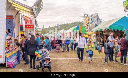 SARINA, QUEENSLAND, AUSTRALIA - AUGUST 2019: Crowd on sideshow alley enjoying local country show Stock Photo
