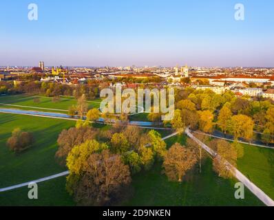 English garden with Schwabinger Bach in the morning light, curfew, view of the old town, Munich, aerial view, Upper Bavaria, Bavaria, Germany Stock Photo