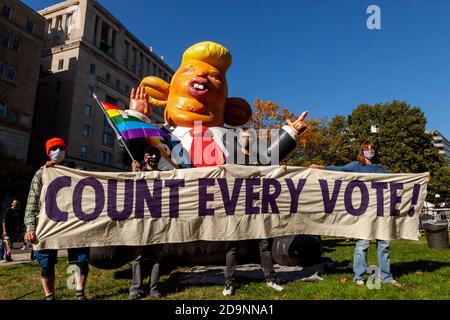 Washington Dc Usa 6 November 2020 Pictured Protsters Carrying The Banner At The Front Of The March Posed With An Inflatable Pig Version Of Trump During The Count Every Vote Rally And