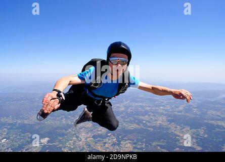 Skydiver having fun at the skies Stock Photo