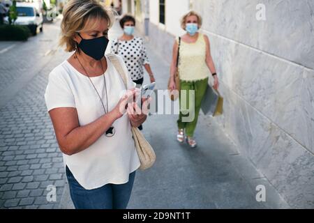 woman sending messages by cell phone Stock Photo