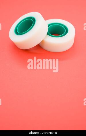 A top view closeup of two white duct tapes isolated on a bright pink background Stock Photo