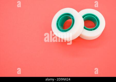 A top view closeup of two white duct tapes isolated on a bright pink background Stock Photo