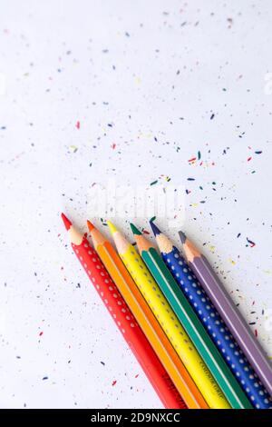 colorful pencils crayons on white table, rainbow colors, closeup Stock Photo