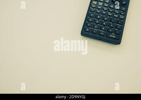 A top view closeup of a graphing calculator isolated on a white background Stock Photo