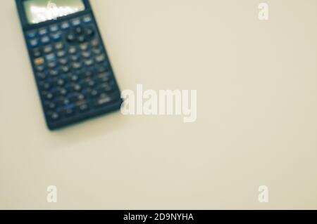 A top view closeup of a graphing calculator isolated on a white background Stock Photo