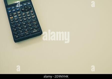 A top view closeup of a graphing calculator isolated on a white background Stock Photo