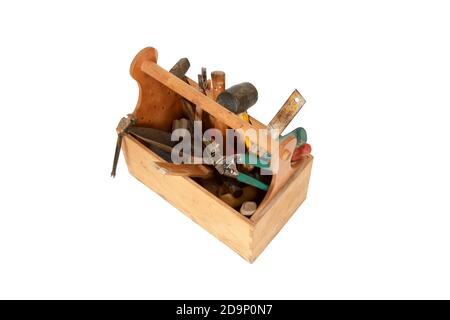 A wooden craftsman toolbox with tools and equipment isolated on a white background Stock Photo