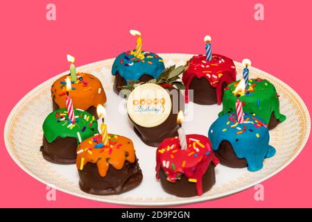 Birthday Fruit Cupcakes on a Plate, Isolated on Pink Stock Photo
