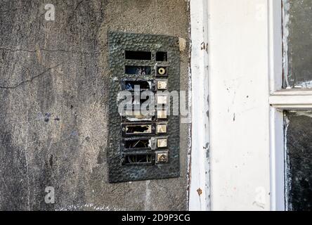 Gelsenkirchen, Ruhr area, North Rhine-Westphalia, Germany - doorbell system on the front door of a scrap property, residential street with vacant scrap property in the residential area of the former Consolidation colliery in the Gelsenkirchen-Bismarck district. Stock Photo