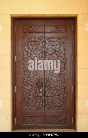Beautiful Carving Pattern of a Mosque Wooden Door Stock Photo
