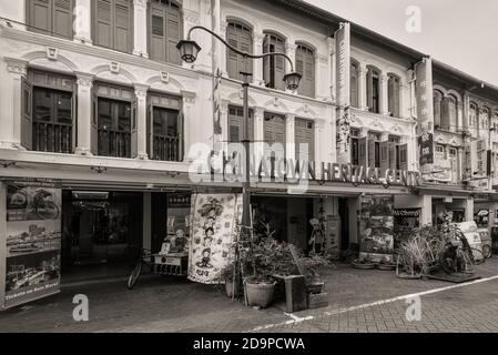 Singapore - December 5, 2019: View of the Chinatown Heritage Centre at Pagoda Street in Singapore. Black and white photo sepia toned in retro style. Stock Photo