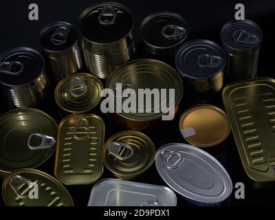 Different types of cans with prepared foods for consumption, vegetables, fish and meat Stock Photo