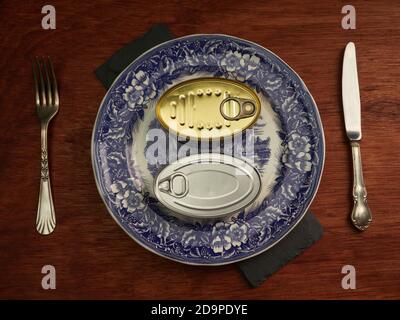 Different types of cans with prepared foods for consumption, vegetables, fish and meat Stock Photo
