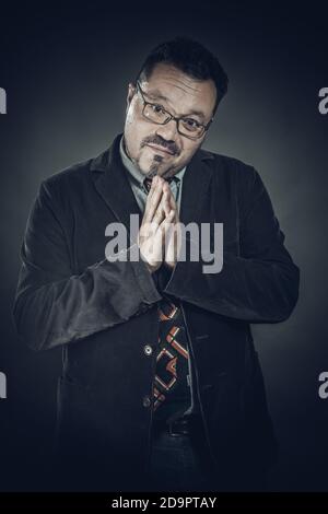 Solid cheerful man in spectacles emotional studio portrait Stock Photo