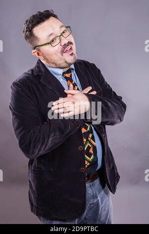 Solid cheerful man in spectacles emotional studio portrait Stock Photo