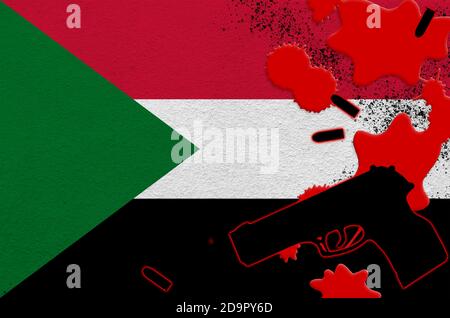 Sudan flag and black firearm in red blood. Concept for terror attack or military operations with lethal outcome. Dangerous handgun usage Stock Photo