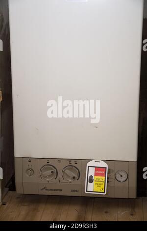 British central heating boiler broken, condemned and shut down by British  Gas Stock Photo - Alamy