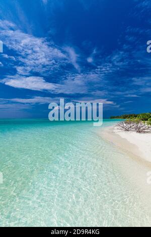 White sandy beach in Maldives with amazing blue lagoon and blue sky Stock Photo