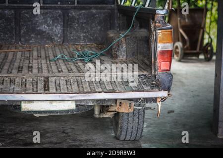Behind the old brown pickup truck Stock Photo