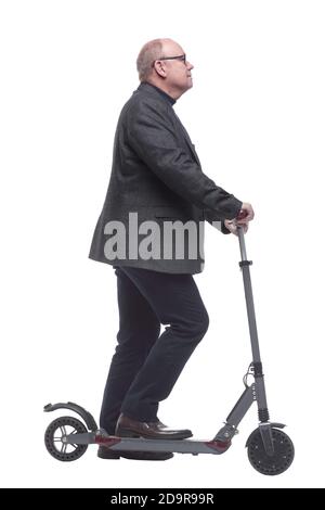 side view . Mature man with electric scooter looking forward Stock Photo