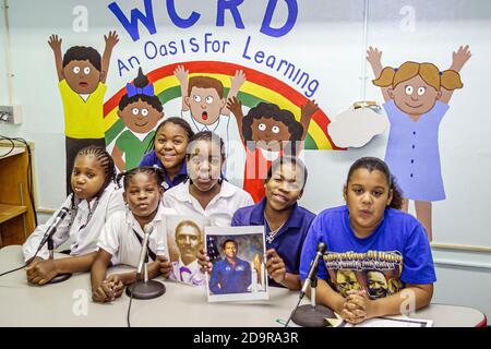 Miami Florida,Liberty City Charles Drew Elementary School,televised morning announcements student students Black,boy boys girl girls microphone microp Stock Photo