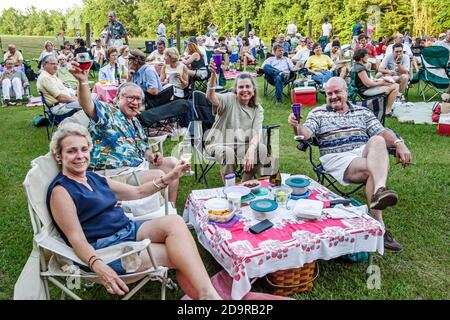 Louisiana Northshore,Mandeville Pontchartrain Vineyards,Jazz'n the Vines Outdoor Concert Series,audience drinks lawn picnic man women couples friends, Stock Photo