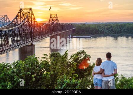 Mississippi Vicksburg Mississippi River Bridge,sunset,man woman female couple watch, Stock Photo